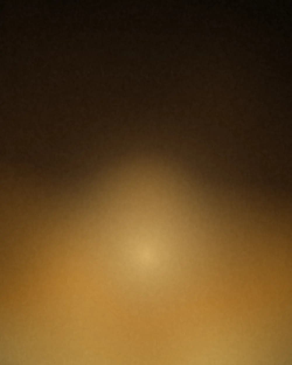 Amber glow rising out of near-black