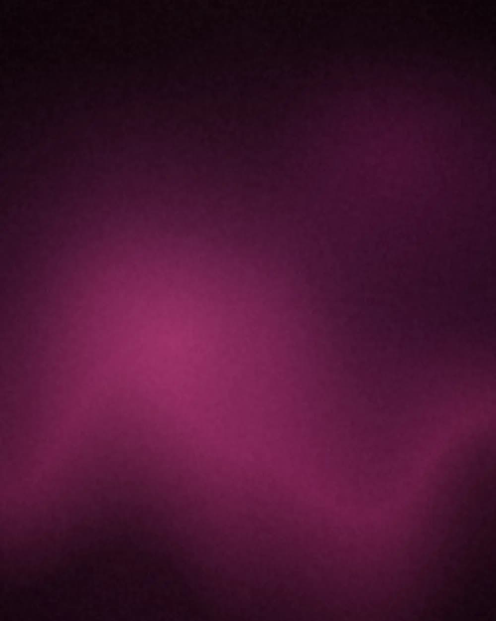 Plum smoke drifting through magenta light